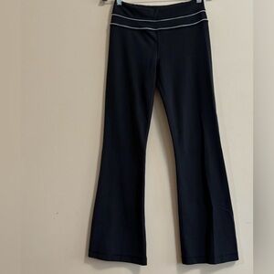 Black and white women’s Lululemon flare leggings